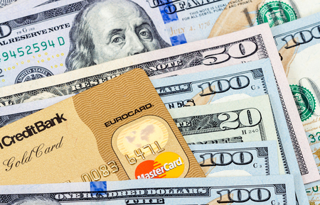 SAMARA, RUSSIA - NOVEMBER 15, 2015: MasterCard Credit Card with American Dollar billsのeditorial素材