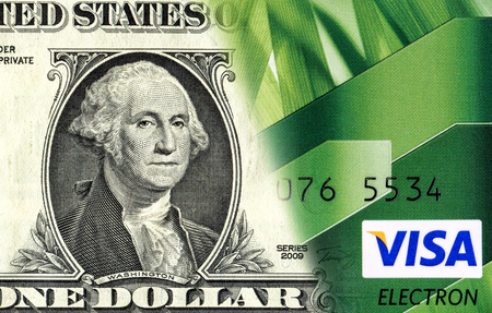 SAMARA, RUSSIA - JANUARY 8, 2016: Banknote of one american dollar is converted to a credit card. Concept imageのeditorial素材