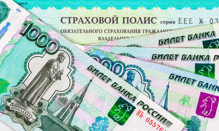 SAMARA, RUSSIA - JANUARY 29, 2016: Car Insurance. Compulsory Third Party/Green Slip Insurance policy and russian rubles. Text in russian: Insurance policyのeditorial素材