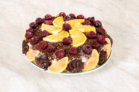 Homemade cake with fruits on a white background