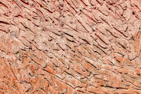 Fragment of the rough stone wall as backgroundの写真素材