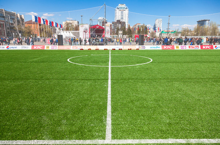 SAMARA, RUSSIA - APRIL 24, 2016: White lines marking on green grass on the soccer or football field. Open sport festival on the central square in Samara, Russiaのeditorial素材
