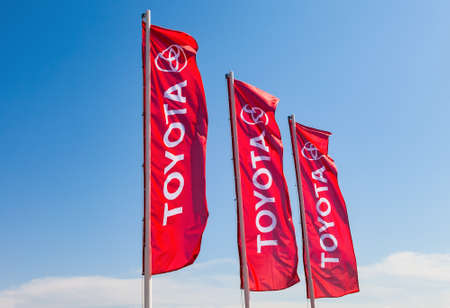 SAMARA, RUSSIA - MAY 29, 2016: Official dealership flags of Toyota against the blue sky background. Toyota Motor Corporation is a Japanese automotive manufacturerのeditorial素材