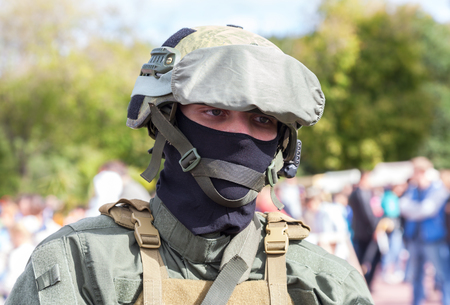 SAMARA, RUSSIA - SEPTEMBER 11, 2016: Unidentified member of military club in camouflage army uniform and helmet during military reenacting in Samara, Russiaのeditorial素材