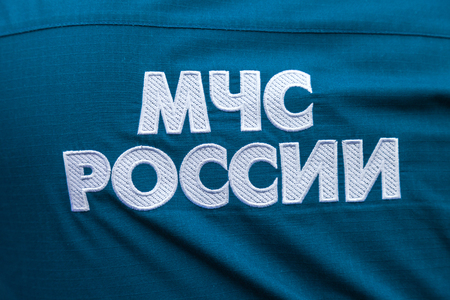 SAMARA, RUSSIA - SEPTEMBER 11, 2016: Midsection of russian emercom officer in uniform. Text in russian: "Emercom of Russia"のeditorial素材