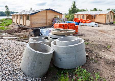 BOROVICHI, RUSSIA - AUGUST 19, 2016: Construction of a new wooden houses in summer cloudy day at the bank of lakeのeditorial素材