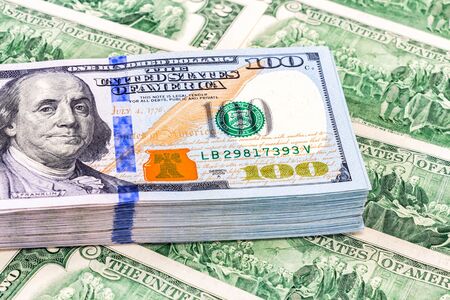 Stack of one hundred american dollar bills close upの写真素材
