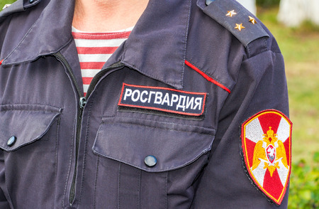 Samara, Russia - September 10, 2017: Russian police officer in uniform of National Guard of the Russian Federation (Rosgvardia). Rosgvardia is the internal military force of the government of Russia. Text in russian: "Rosgvardia"のeditorial素材