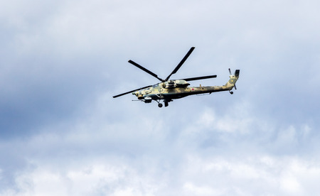 Samara, Russia - September 10, 2017: Russian Air Force Mi-28 Havoc military attack combat helicopter in camouflage flying against cloudy skyのeditorial素材