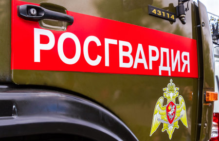 Samara, Russia - September 10, 2017: Inscription "Rosgvardia" and emblem of the troops of the National Guard of the Russian Federation on the board of car. Rosgvardia is the internal military force of the government of Russia. Text in russian: "Rosgvardiaのeditorial素材