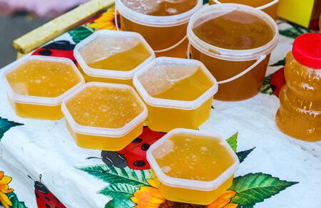 Sweet fresh honey ready for sale at the traditional farmers marketの写真素材