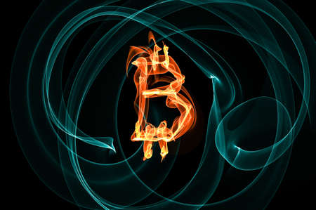 Bitcoin sign over black background. Light paintingの写真素材