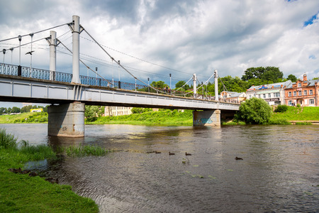 Torzhok, Russia - July 16, 2017: Pedestrian bridge across the Tvertsa river in summer dayのeditorial素材