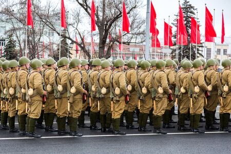 Samara, Russia - November 6Ð± 2017: Soldiers in old soviet military uniform. Reenactment of the parade in 1941 at the Kuibyshev squareのeditorial素材