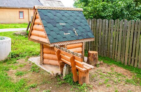 Village wooden water well at the countryside in summer dayのeditorial素材