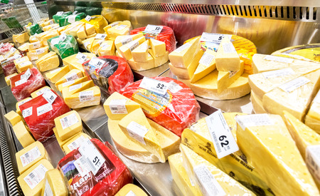 Samara, Russia - November 19, 2017: Tasty cheese in the showcase ready to sale in supermarket Karusel. Russia's largest food retailerのeditorial素材