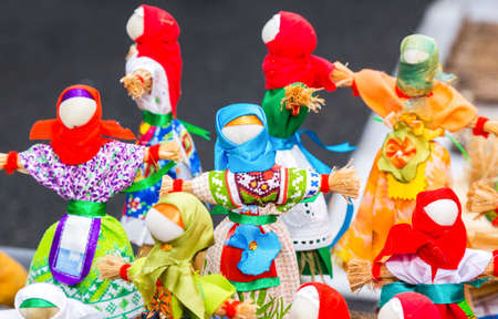 Traditional handmade straw dolls gift on the Shrovetide carnival. Maslenitsa or Pancake Week in the Russiaの写真素材