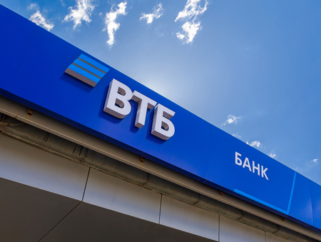 Samara, Russia - April 30, 2018: Logo of the Russian VTB bank against the blue sky. One of the largest russian banksのeditorial素材
