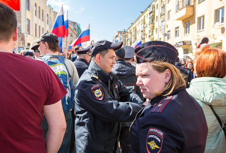 Samara, Russia - May 5, 2018: Russian policeman and policewoman during an opposition protest rallyのeditorial素材