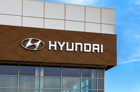 Samara, Russia - May 19, 2018: Hyundai dealership logo on the facade of official dealer. Hyundai Motor Company is a South Korean multinational automotive manufacturerのeditorial素材