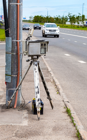 Kazan, Russia - June 12, 2018: Traffic enforcement camera and vehicles in motion on city streetのeditorial素材