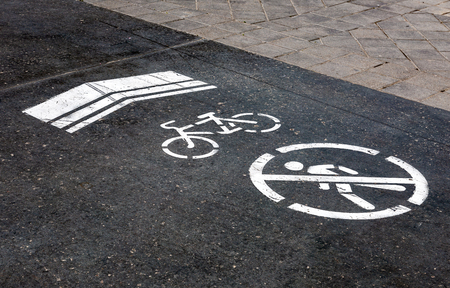 Bike lane with road symbols painting on asphaltの写真素材