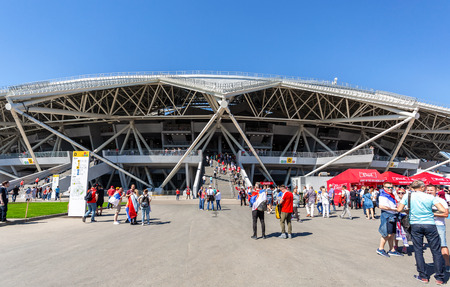 Samara, Russia - June 17, 2018: Merry and decorated football fans next to the Samara Arena Stadium during the 2018 FIFA World Cup Russiaのeditorial素材