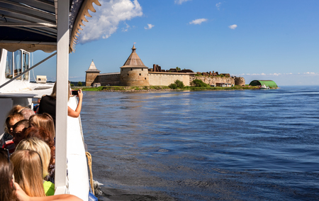 Shlisselburg, Russia - August 8, 2018: River cruise ship sailing on the Neva river to historical fortress Oreshek in summer sunny dayのeditorial素材