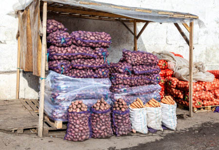 Fresh organic potatoes, onion and carrots of new harvest for sale at the farmers marketの写真素材