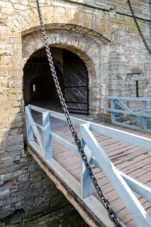 Suspension chain bridge and gates to the historic ancient fortress Oreshek in Shlisselburg, Russiaのeditorial素材