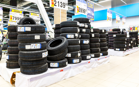 Samara, Russia - May 1, 2018: New vehicle tires stacked up for sale in the chain hypermarketのeditorial素材