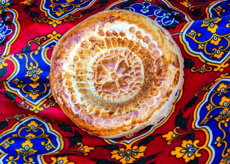 Traditional uzbek flatbread with sesame seeds from the tandyrの写真素材