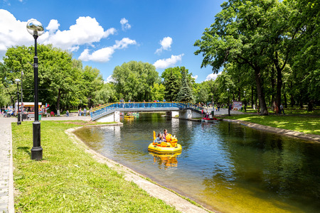 Samara, Russia - June 25, 2017: People ride on pedal boat or water catamaran in the pond at the city park in summer sunny dayのeditorial素材