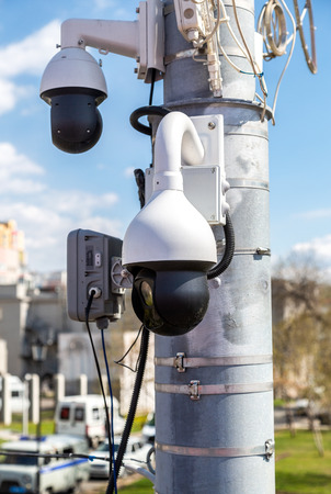 Samara, Russia - May 1, 2019: Surveillance CCTV cameras mounted on post against the blue skyのeditorial素材