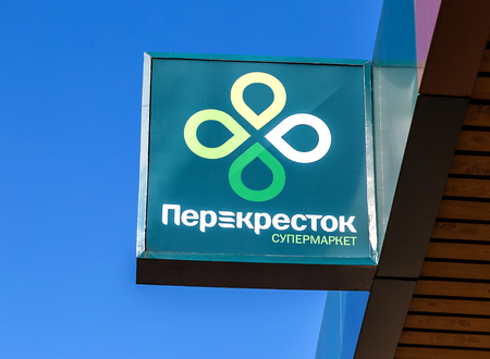 Samara, Russia - May 4, 2019: Emblem of a Perekrestok Store against a blue sky. Perekrestok is a Russian supermarket chain operated by X5 Retail Groupのeditorial素材