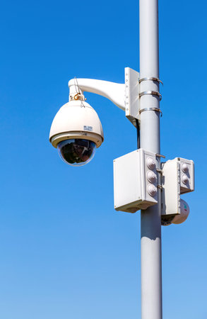 Samara, Russia - May 10, 2019: Surveillance CCTV cameras mounted on post against the blue sky