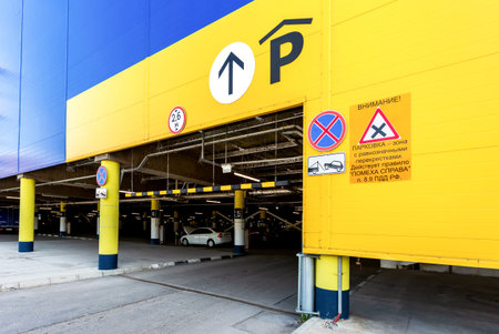 Samara, Russia - June 1, 2019: Entrance to the large underground  parking in shopping center Mega