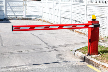 Automatic rising arm barrier for entry or stop traffic. Boom barrier gate acces entry