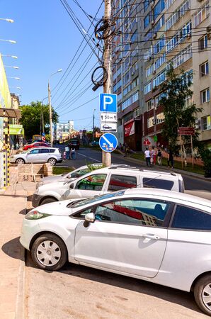 Samara, Russia - June 9, 2019: Different vehicles parked up on the city street in summer sunny dayのeditorial素材