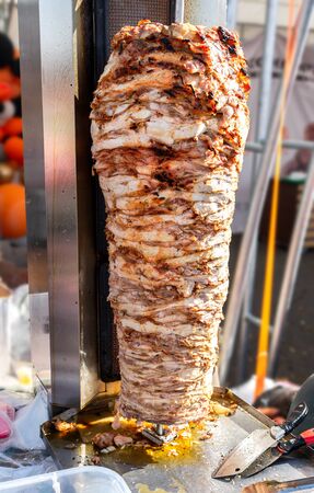Traditional fast food doner kebab meat on a rotary grill. Shawarma is one of the most popular fast foodの写真素材