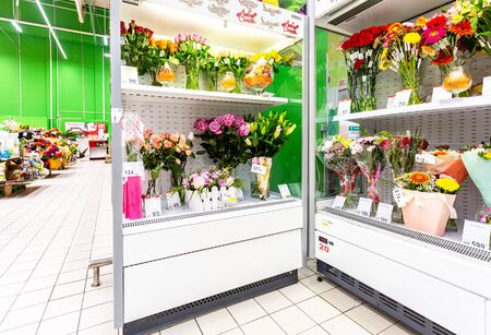 Samara, Russia - September 14, 2019: Various fresh flowers ready to sale at showcase in the chain hypermarketのeditorial素材
