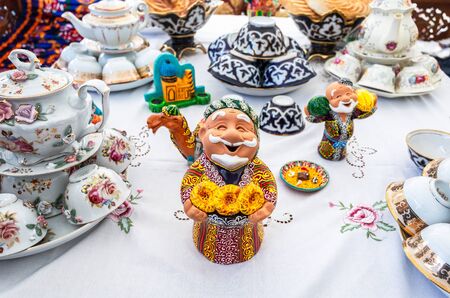Samara, Russia - October 5, 2019: Ethnic Uzbek ceramics tableware on the table. Decorative ceramic with traditional uzbekistan ornamentのeditorial素材