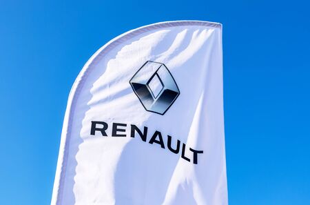 Samara, Russia - October 26, 2019: Dealership flag of Renault against the blue sky. Renault is the French automakerのeditorial素材