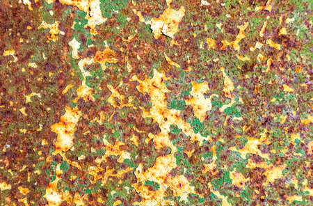 Rusty metal texture as background with streaks of rust. Old sheet of iron covered with rust and...