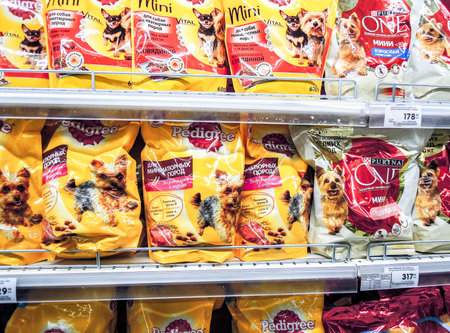 Samara, Russia - December 21, 2019: Various fresh dog food ready for sale on supermarket shelves....