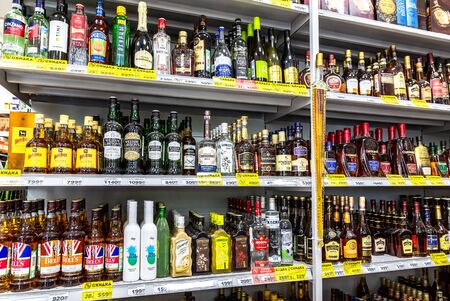 Samara, Russia - May 25, 2019: Various bottled alcoholic beverages ready for sale on the shelf in superstoreのeditorial素材