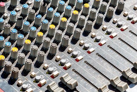 Part of sound music mixer control panel with buttonsの写真素材