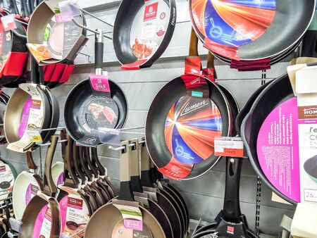 Samara, Russia - September 26, 2019: Various frying pans, cooking pots, utensils for sale on store shelfのeditorial素材
