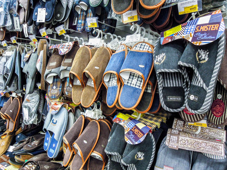 Samara, Russia - September 26, 2019: Various slippers ready to sale at showcase in the chain...