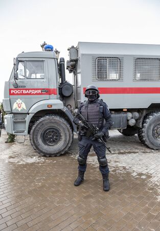 Samara, Russia - February 23, 2020: Special Forces soldier of Rosgvardia in uniform with rifle and helmet. Rosgvardia is the internal military force of the government of Russiaのeditorial素材